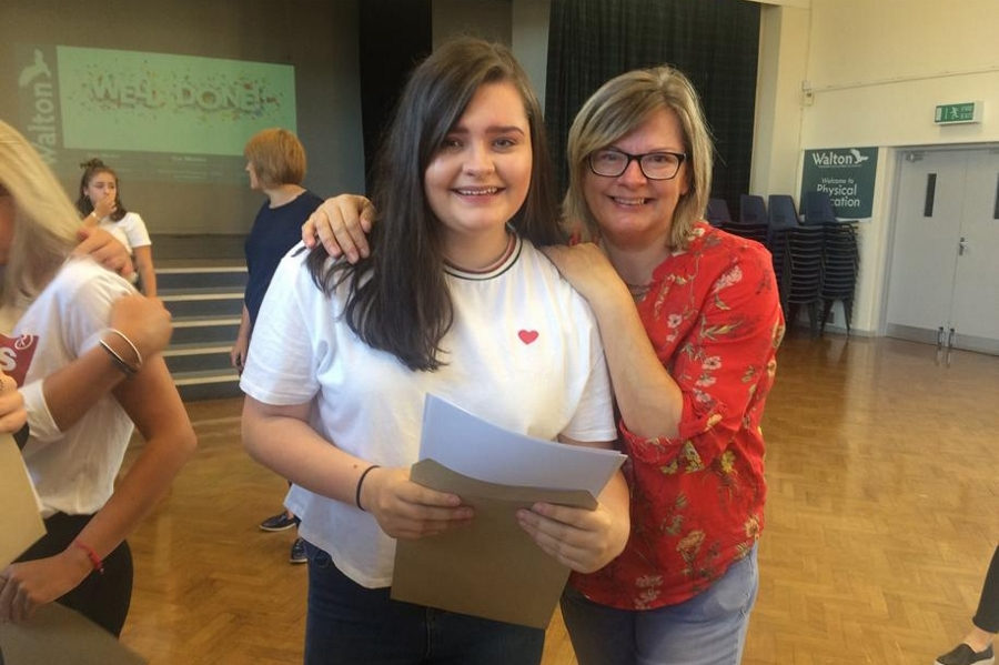Strong GCSE Results - Pupil receiving her results with her parent - Lincolnshire Magazine - LincsMag.com