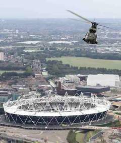 A Royal Air Force 230 Squadron Puma HC1 is pictured flying over the 2012 Olympic Stadium during a training flight over London. - Crown Copyright - Photo: SAC Phil Major RAF/MoD - 2012 Olympic Games Military Support - Lincolnshire Magazine - LincsMag.com